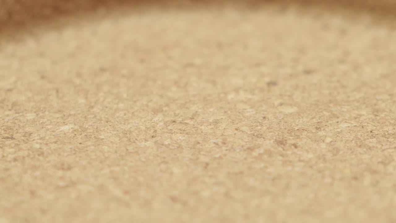 Macro detail of a smooth leather surface showing subtle grain and warm brown tone. Perfect for product, fashion, or design concepts