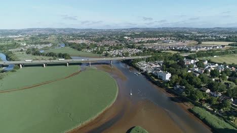 Topsham,-Devon-aerial-tracking-forward-towards-the-M5-flyover