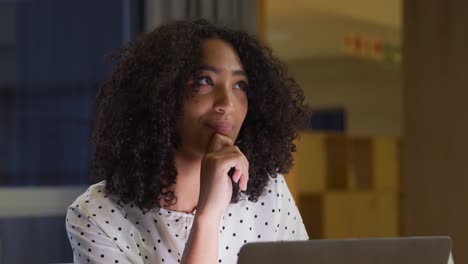 Businesswoman-working-on-laptop-in-a-modern-office