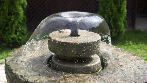 concrete fountain in the wind in the park