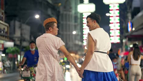 4k asian lgbtq guy friends meeting together in the city at night.