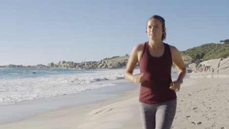 Running-on-beach,-fitness-and-woman