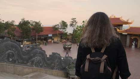 woman visiting a buddhist temple