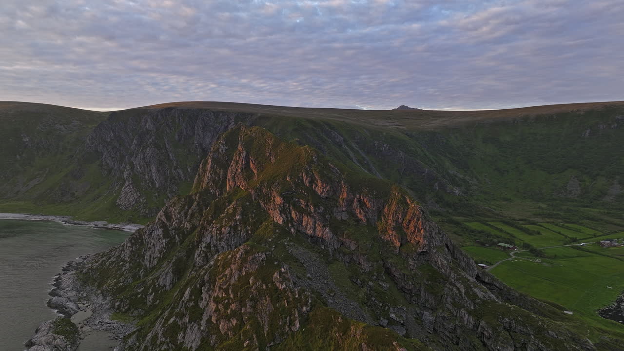 Stave Norway Aerial v12 norwegian scenic view, flyover coastal mountainside capturing details of rocky mountain ridges, panning reveals beautiful golden sunset - Shot with Mavic 3 Cine - June 2022