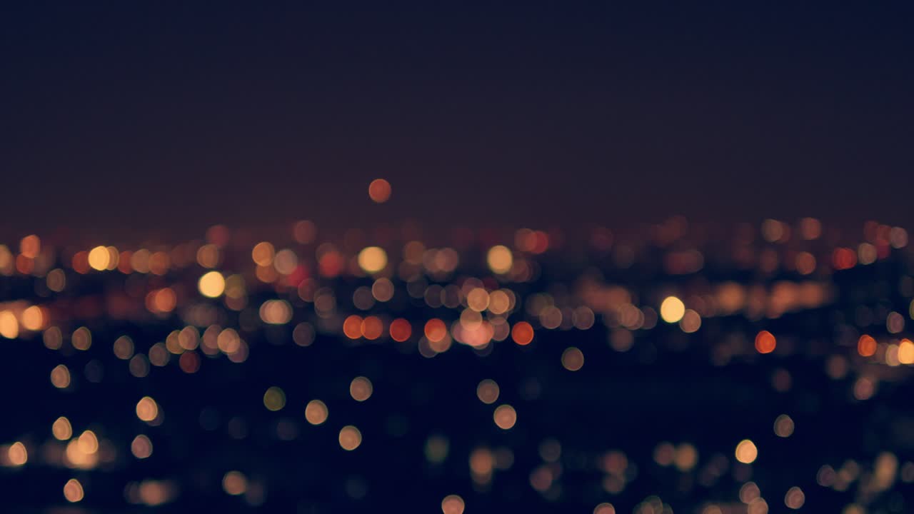 A mesmerizing view of a cityscape illuminated by vibrant bokeh lights at night capturing urban beauty