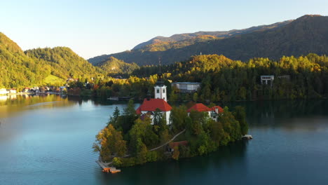 rotating aerial shot of the pilgrimage church of the assumption of mary, slovenia