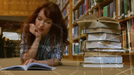 Woman-reading-book-while-lying-on-the-ground