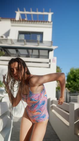 teenager in colorful swimsuit outdoors