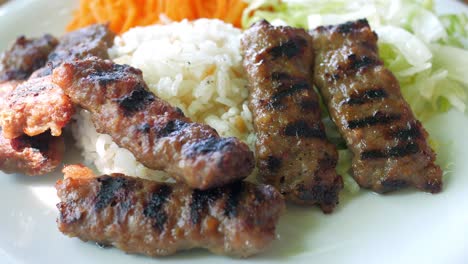 grilled turkish köfte with rice and vegetables