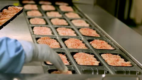 Packages-of-freshly-frozen-shellfish-and-shrimp-are-placed-onto-conveyor-belt