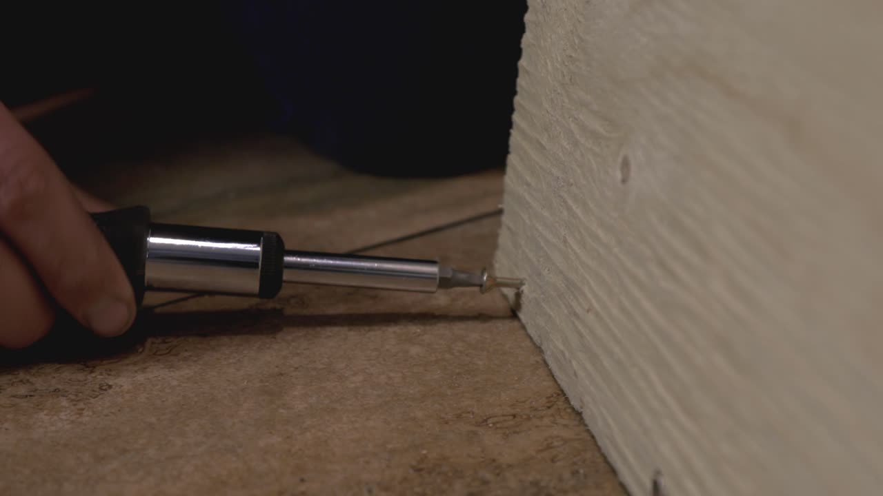 ]The Insertion Of The Small Screw By Continuously Turning The Screwdriver