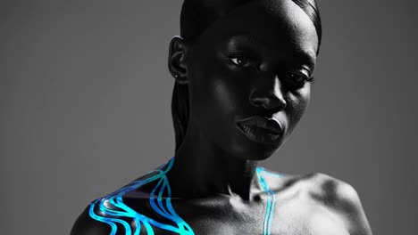 black woman with neon blue body paint