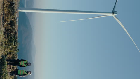 Renewable Energy Engineers Team Working at Wind Farm