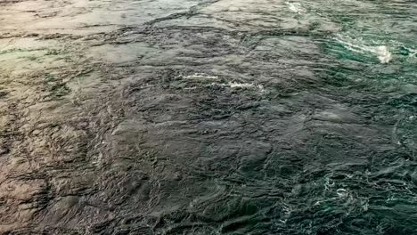 waves of water of the river and the sea meet each other during high tide and low tide.