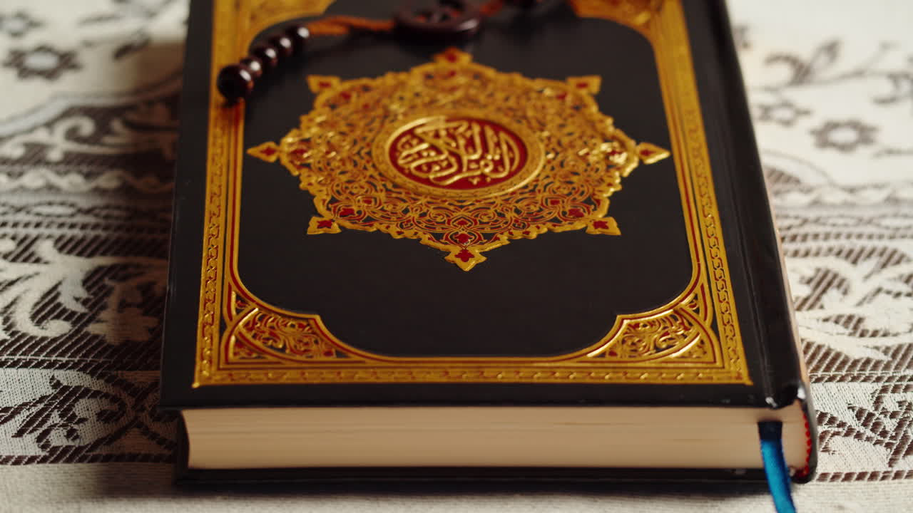 Quran book close-up, praying, islamic religion. Religious holiday Ramadan, holy month. Worship, making traditional prayer to God