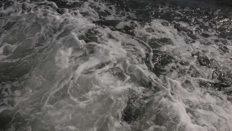 waves from the wake of a boat in slow motion