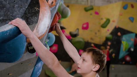 teenager climbing indoors