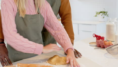 christmas time, diverse couple baking together in kitchen, enjoying festive holiday preparations