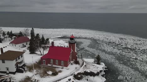 eagle harbor, michigan lighthouse in winter along lake superior