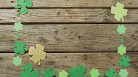 Shamrocks-with-copy-space-on-wooden-background