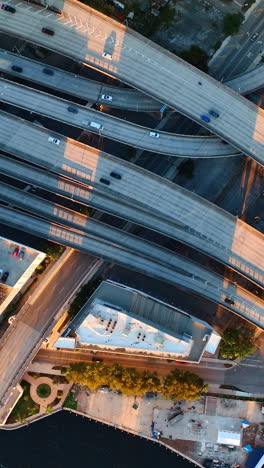 intertwining of numerous highways in the downtown of miami, florida, usa. cars move quickly by the highways. top view. vertical video