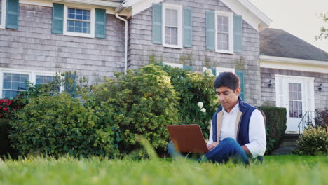 Man-Works-on-Laptop-in-Backyard