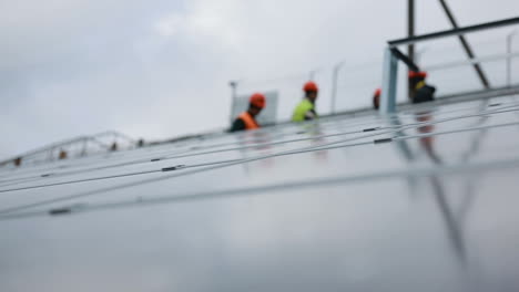 solar panel technician on panels. vinnitsa, ukraine - november 2017: technician install new generation photovoltaic solar panels