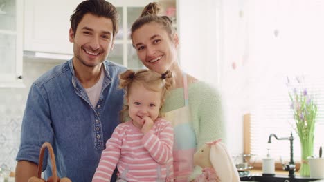 handheld video shows of cheerful family in the kitchen