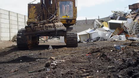 Excavator-machine-being-operated-in-the-junkyard-4k