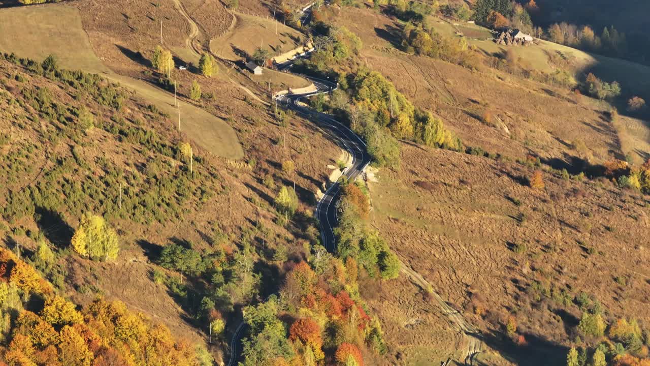Explore the breathtaking beauty of the Apuseni Mountains during autumn, with vibrant fall colors and stunning natural landscapes, captured in this serene aerial footage.