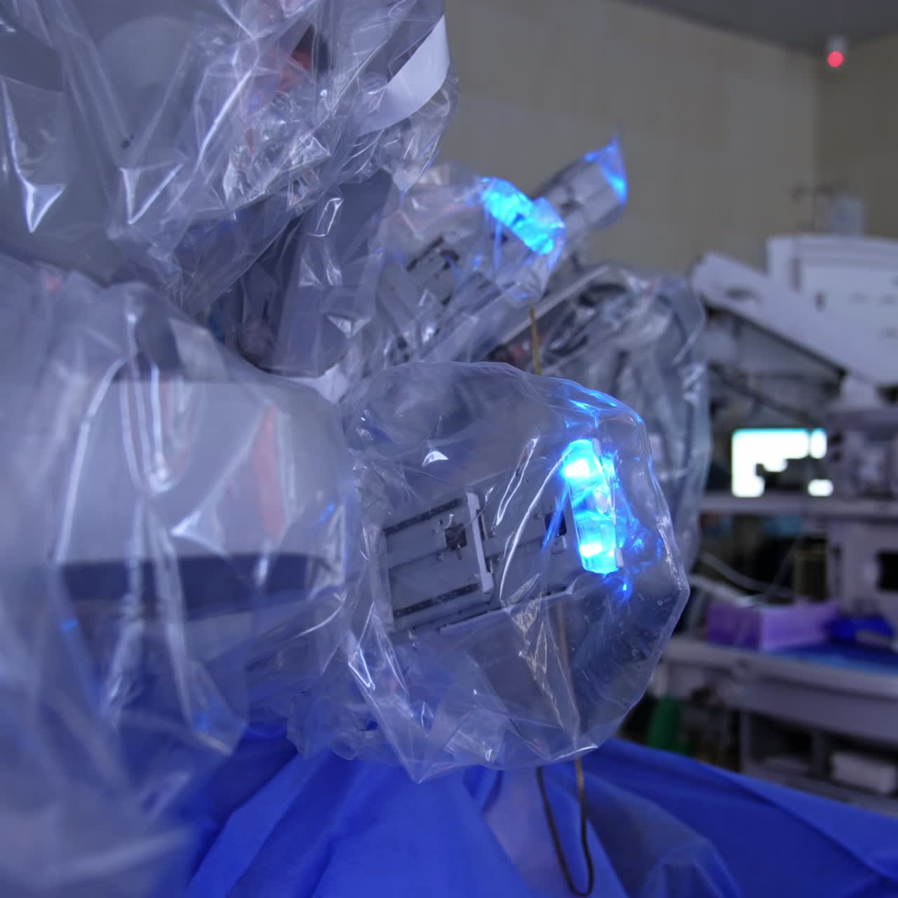 Da Vinci surgery system covered in plastic moving slowly. Contemporary operational room with advanced equipment