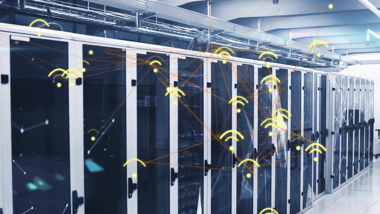 Net monitor detecting spike, firing wireless nodes over data racks for analysis, IT lead gesturing