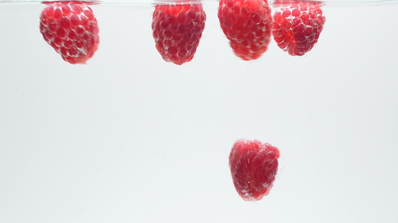 Raspberry on a white background. Shooting on a white background