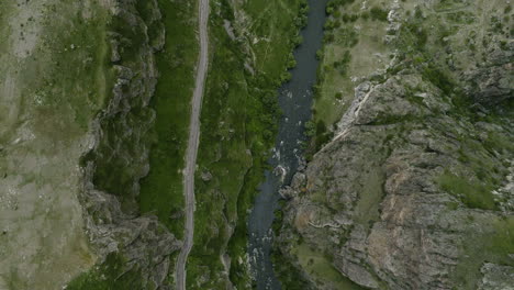 topdown view of mtkvari river flowing in steep gorges of tmogvi fortress in georgia