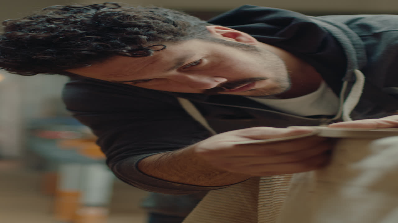 Artisan Polishing Wooden Board Edges with Sand Paper