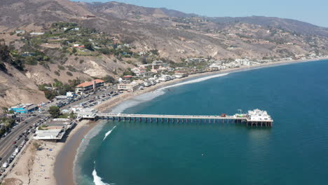 wide panning shot of pier in malibu california