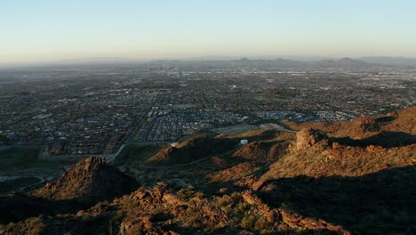 sprawling neighborhoods in phoenix, arizona with mountains in the foreground