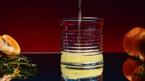 orange juice pouring into a glass