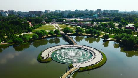 city park with fountain and bridge aerial view