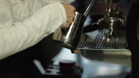 waitress making coffee in a cafe