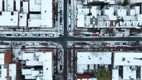 snow covered houses and streets in downtown city in usa