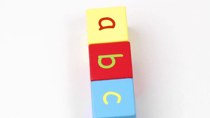 Colorful alphabet toy blocks spelling ABC turning