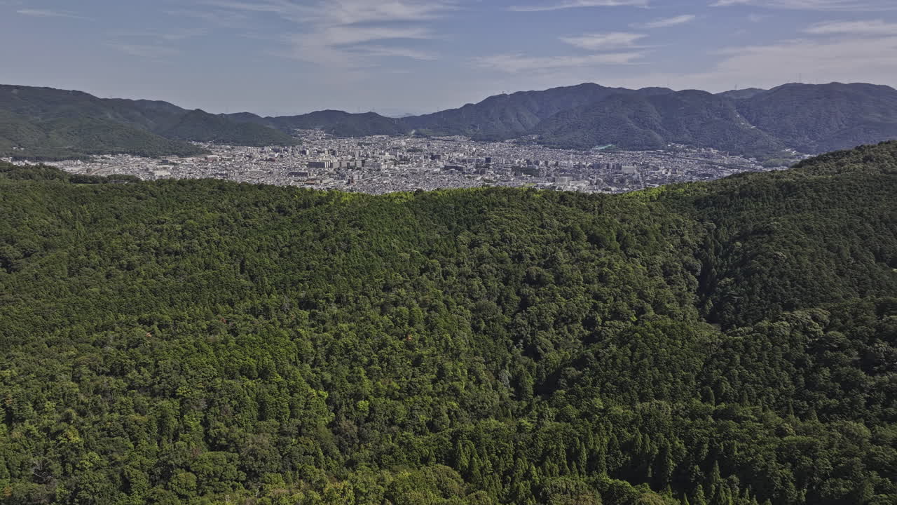 Kyoto Japan Aerial v21 flyover Mount Inari capturing sprawling Yamashina Ward Cityscape nestled between lush, forested mountains on a sunny day - Shot with Mavic 3 Pro Cine - Oct 7th 2023