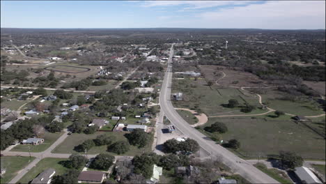 aerial shot over johnson city, texas and hill country near highway 290