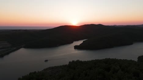 dramatic sunset shadow on mountain near adriatic sea and bright sky near horizon
