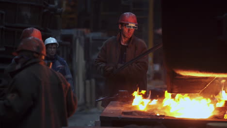 metal casting workers in a factory