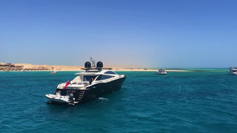 boat on red sea crystal clear turquoise water near hurghada close to the coral reef