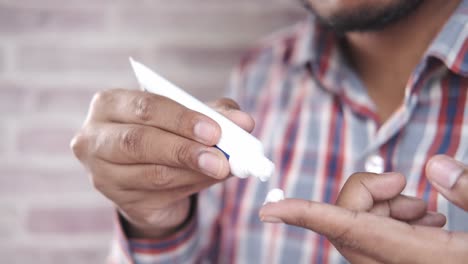 man applying cream