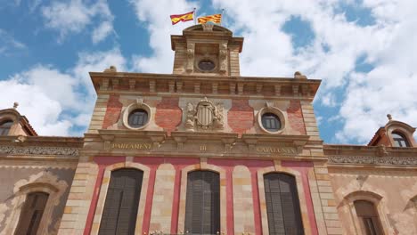 parlament de catalunya facade bright sunny day and blue sky tilt down 4k 60fps