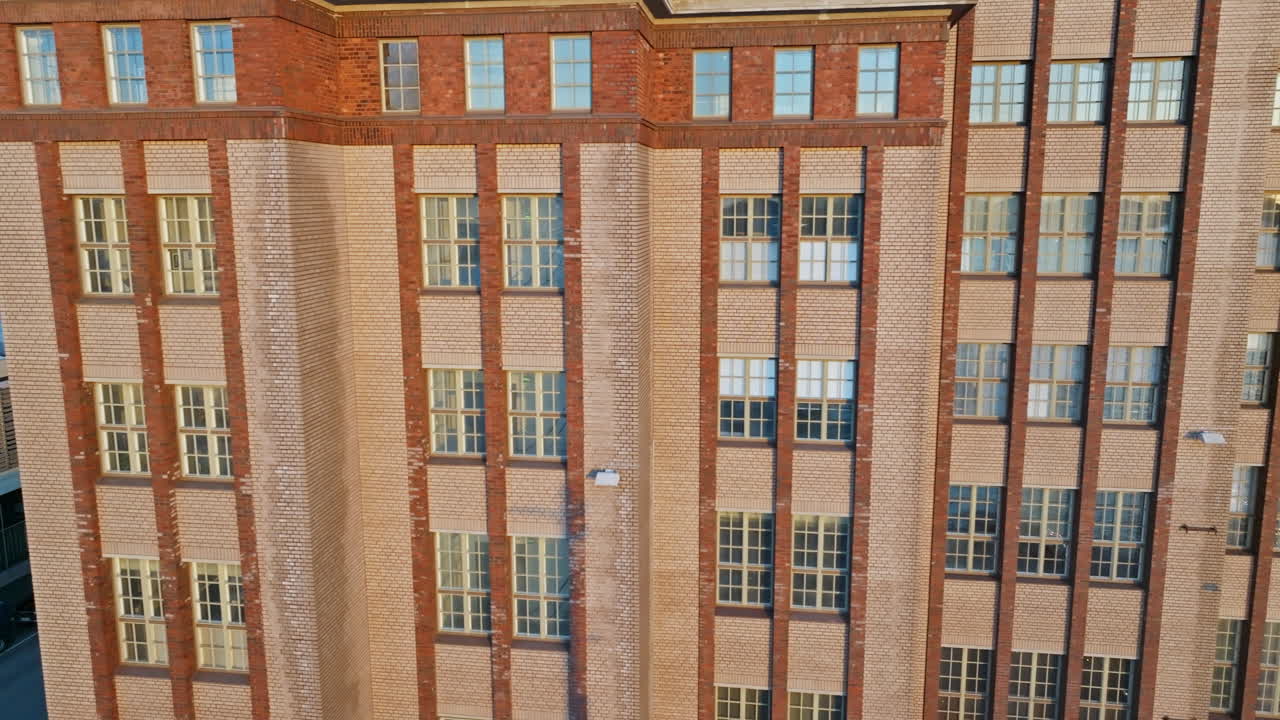 Close-up view of a tall brick building's facade